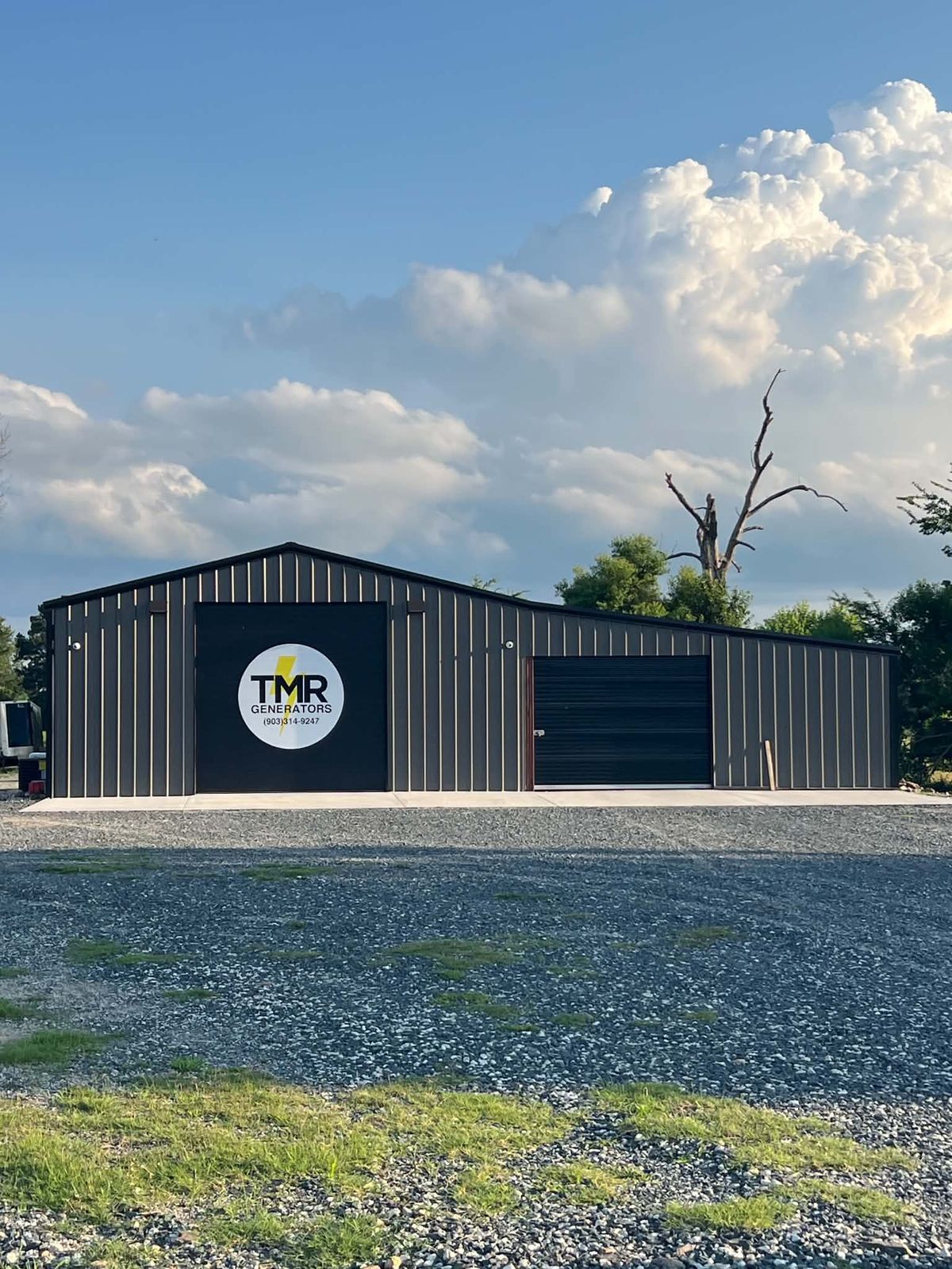 TMR Generators shop building with the logo on the door